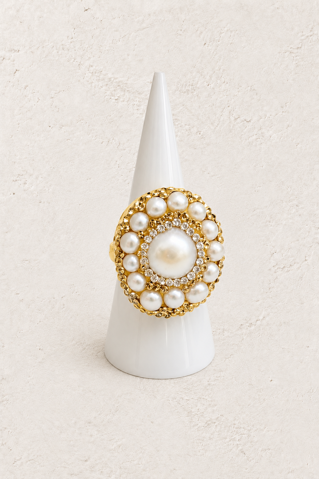 Maravelle Freshwater Pearl Ring on white cone against warm textured background