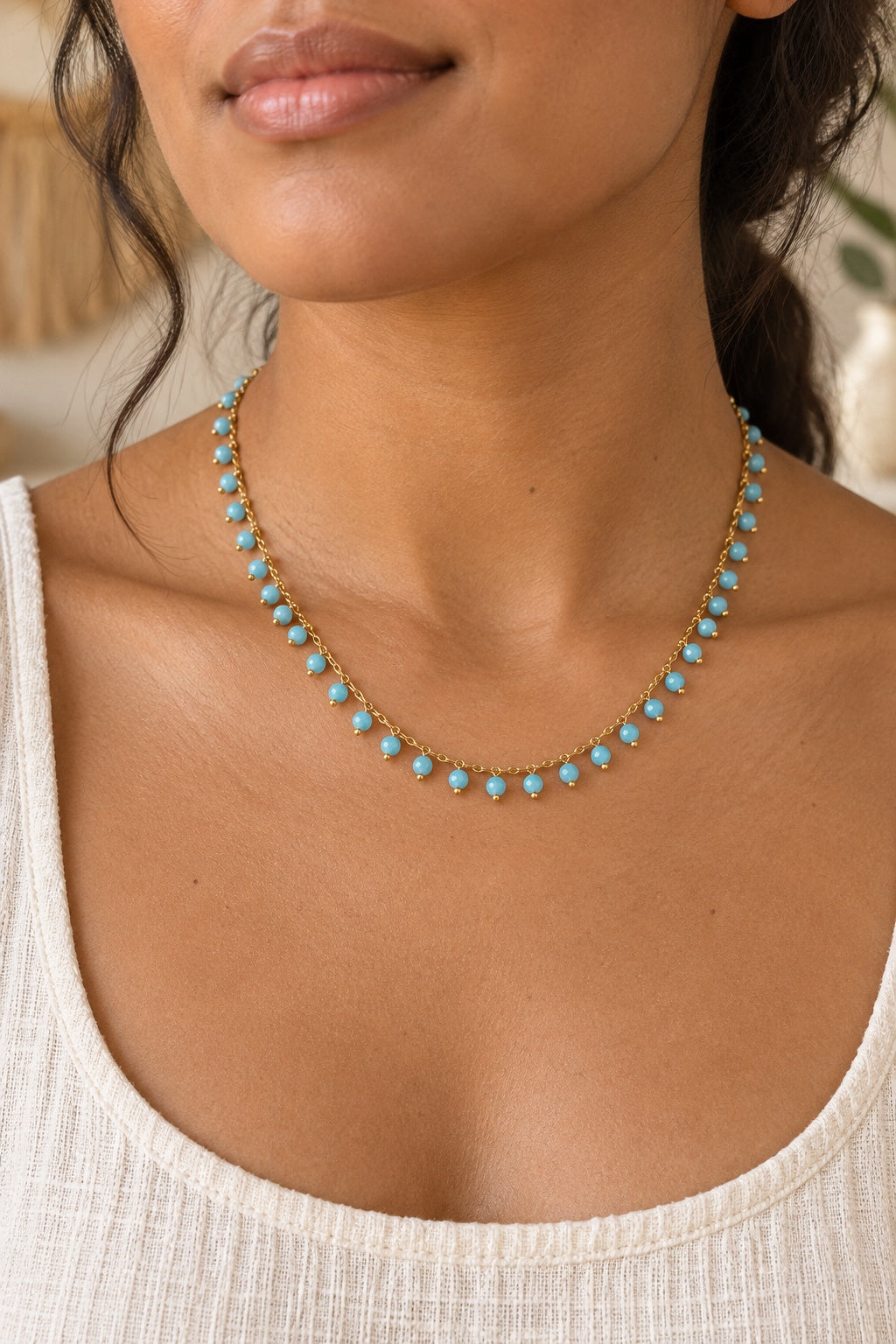 
                  
                    Model wearing the Maraya Turquoise gemstone drop necklace
                  
                