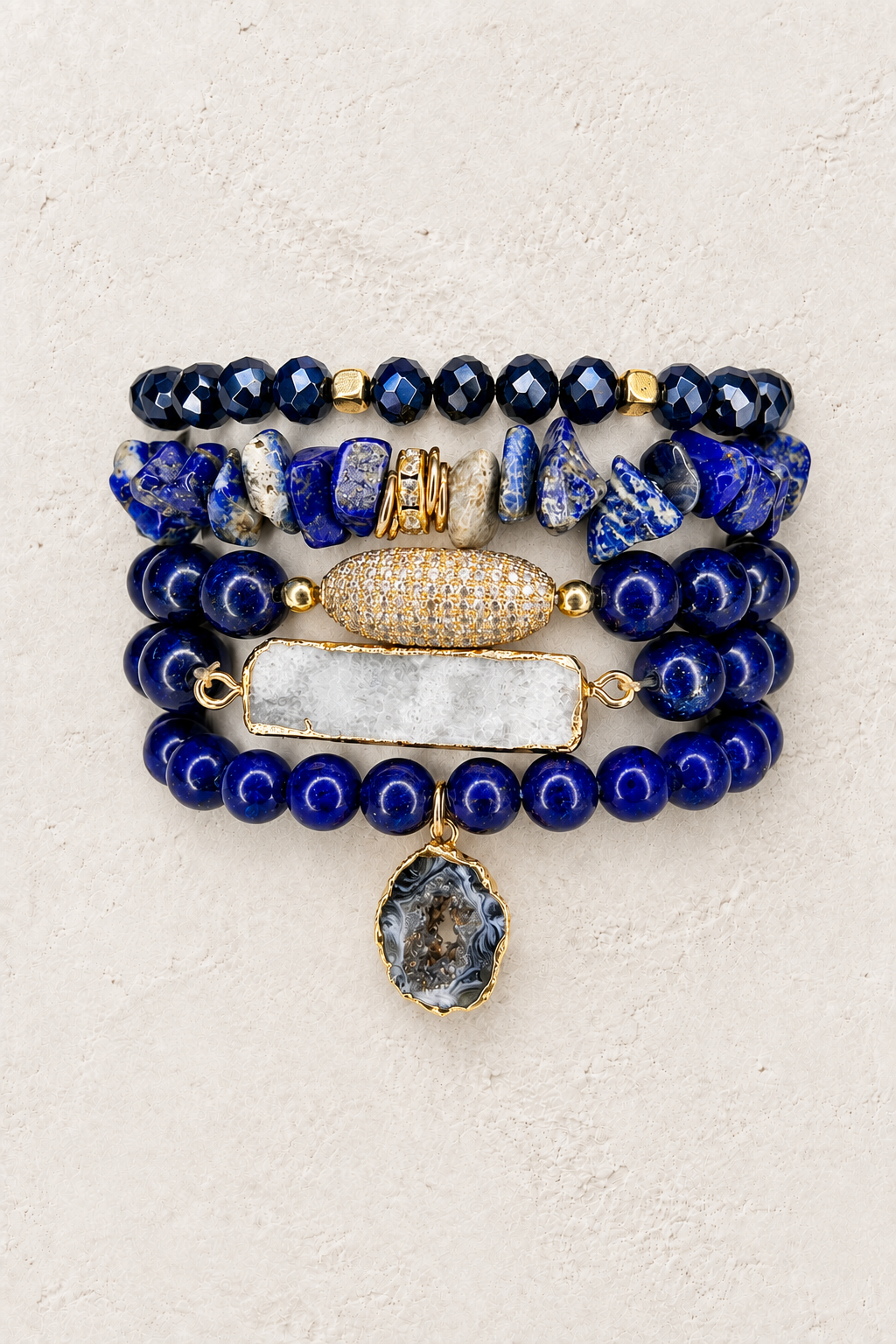 Midnight Majesty 5-piece elastic bracelet stack on warm textured background