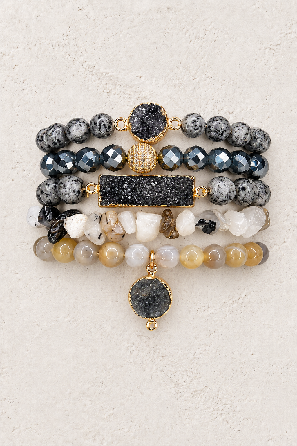 Midnight Moon 5-piece elastic bracelet stack on warm textured background