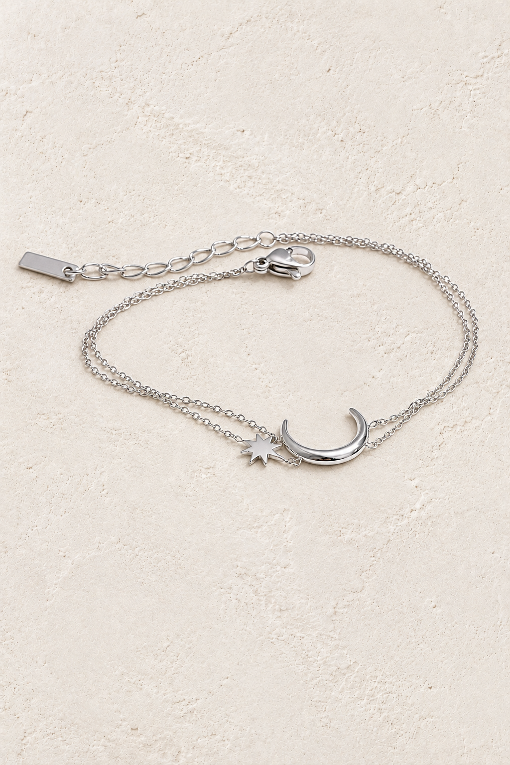 Silver Moon & Star Double Chain Bracelet on approved cream hero background