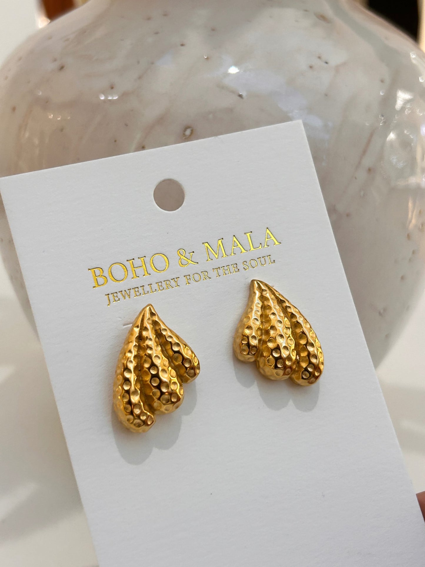 
                  
                    Nerida Textured Shell Studs on Boho & Mala display card
                  
                