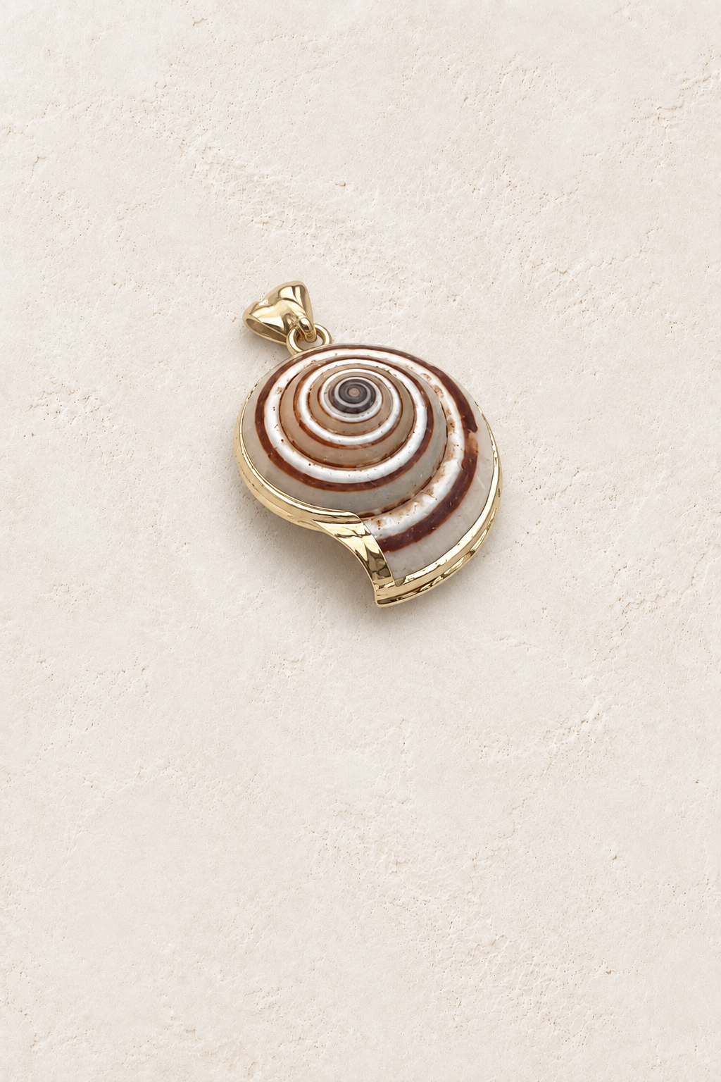 
                  
                    Nerina Spiral Shell Charm Pendant on cream plaster – Boho & Mala
                  
                