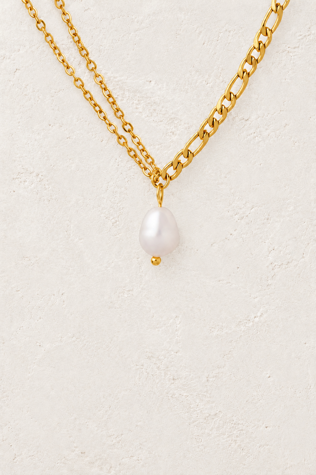 Odette Gold Layered Pearl Drop Necklace on the Boho & Mala cream stone hero background