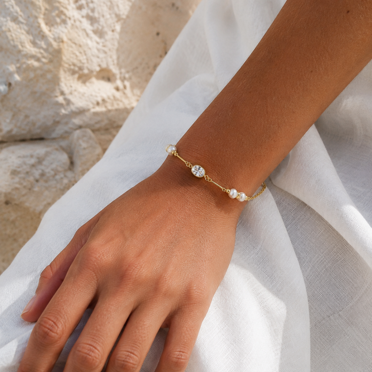 
                  
                    Odette oval crystal and pearl bracelet on boho model
                  
                