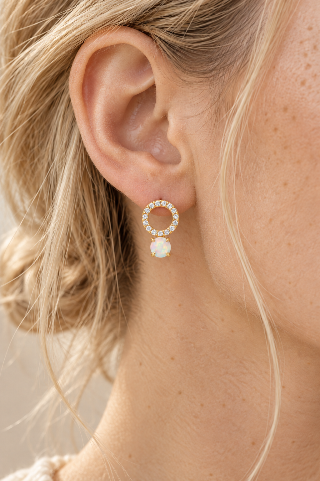 Boho model wearing gold opal pavé circle stud earrings