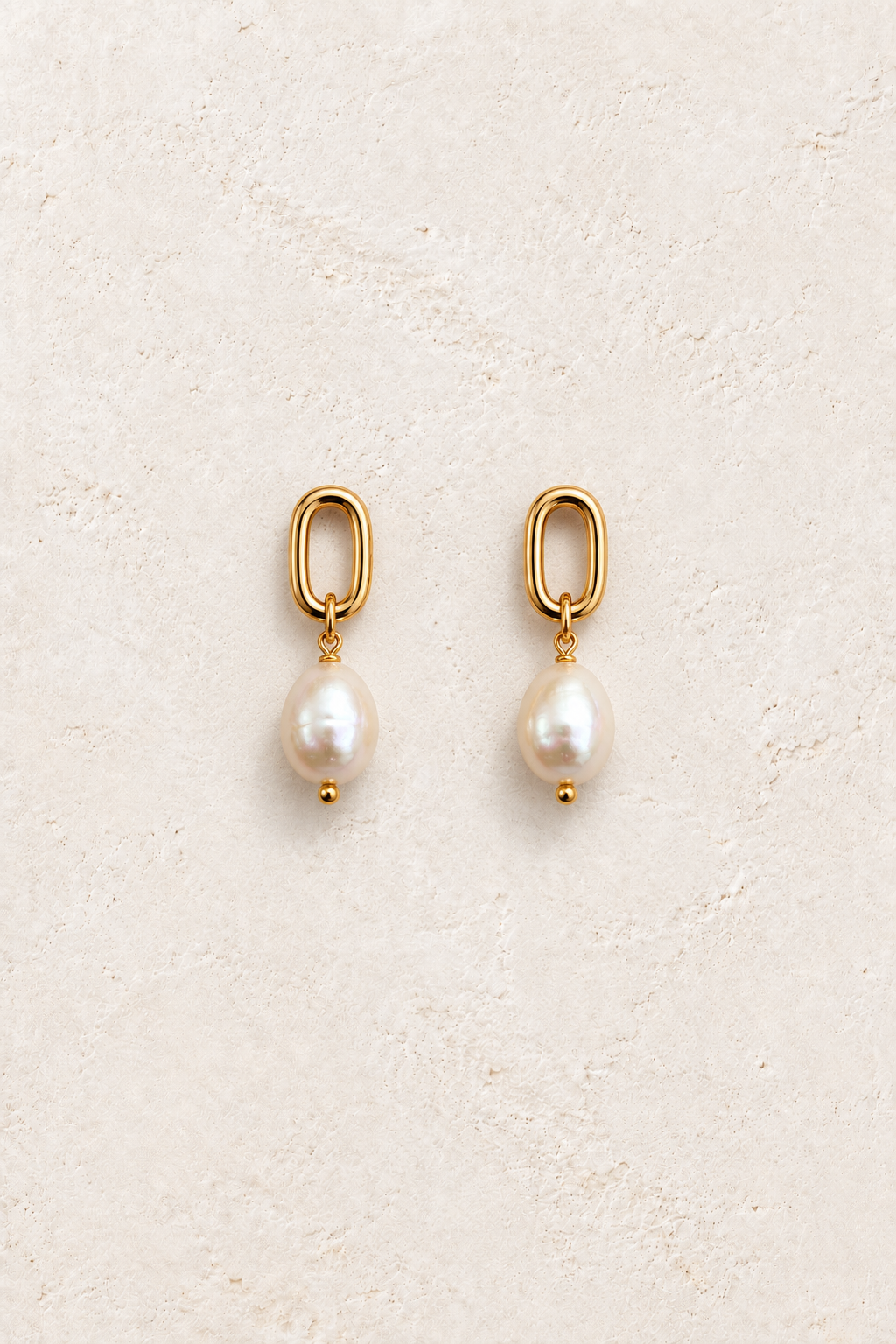 Oria Pearl Link Drops on warm ivory textured background