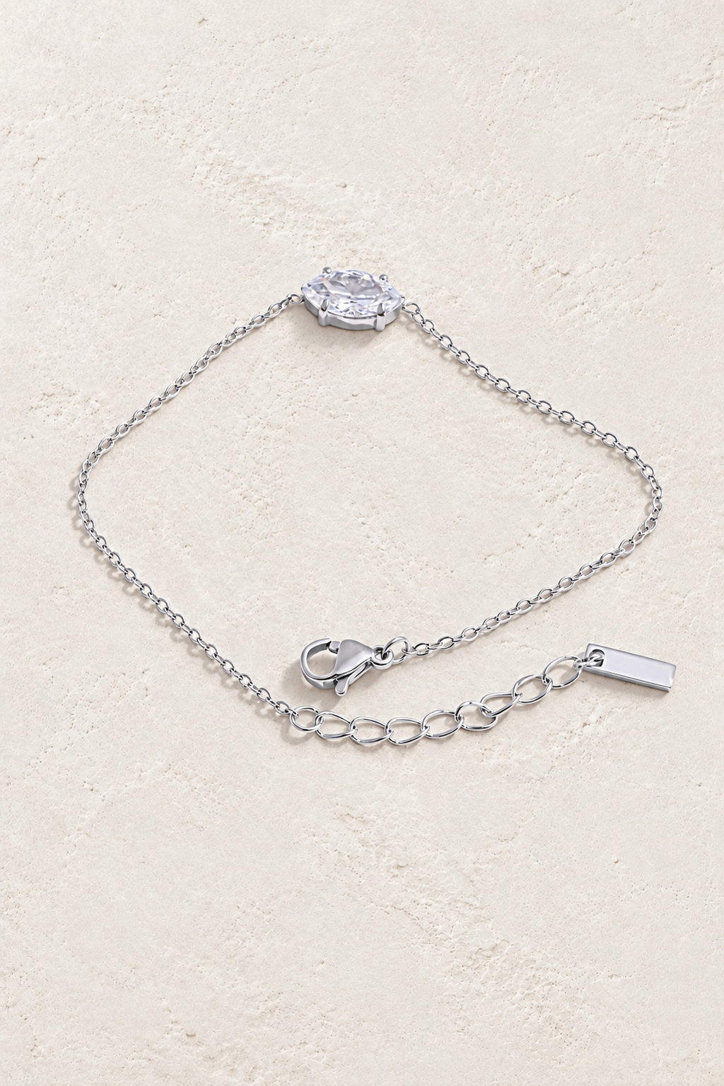 silver oval solitaire bracelet on approved cream hero background
