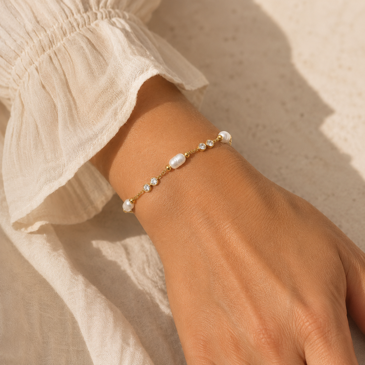 
                  
                    Perla freshwater pearl and crystal bracelet worn on boho model
                  
                