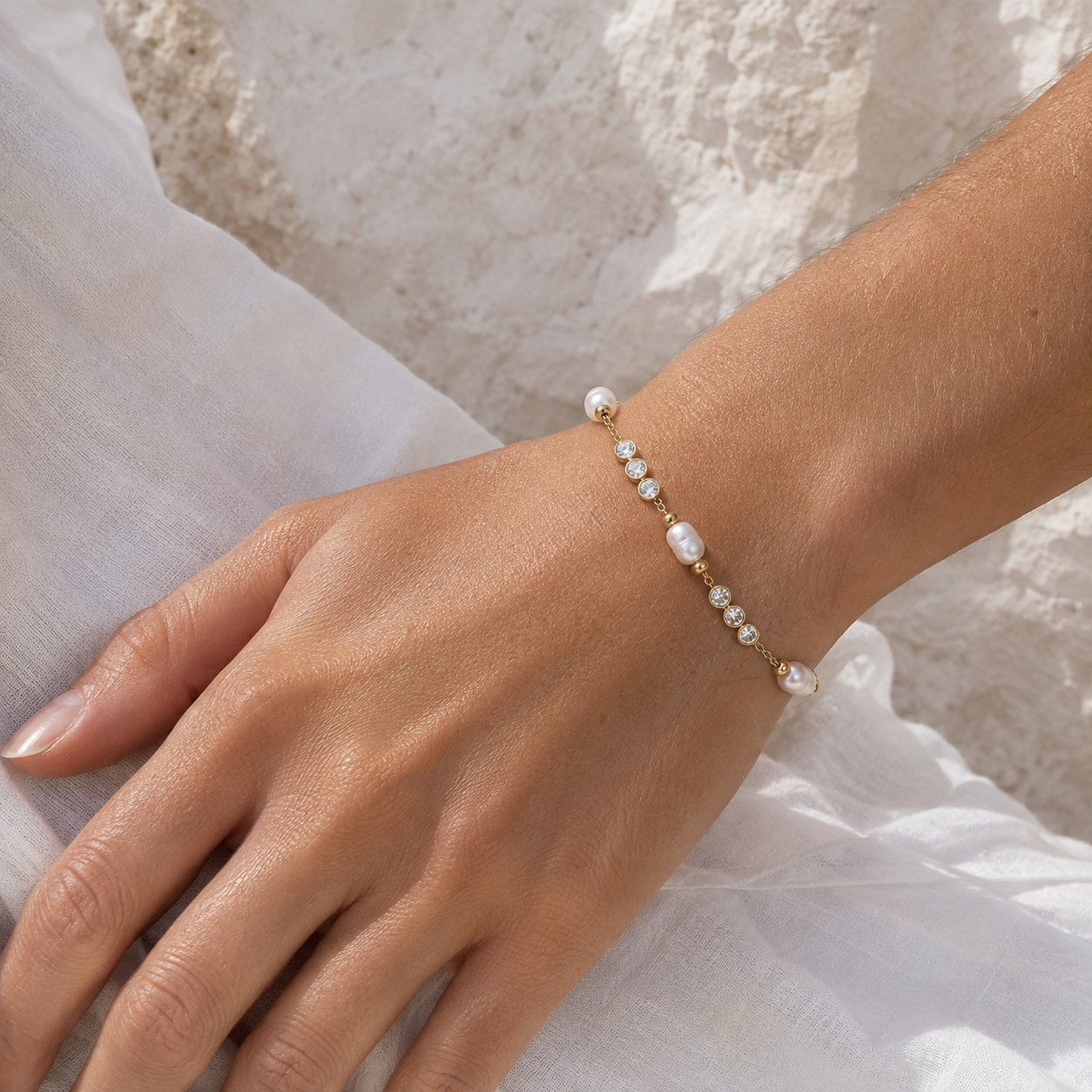
                  
                    Perla freshwater pearl and crystal bracelet on boho model
                  
                