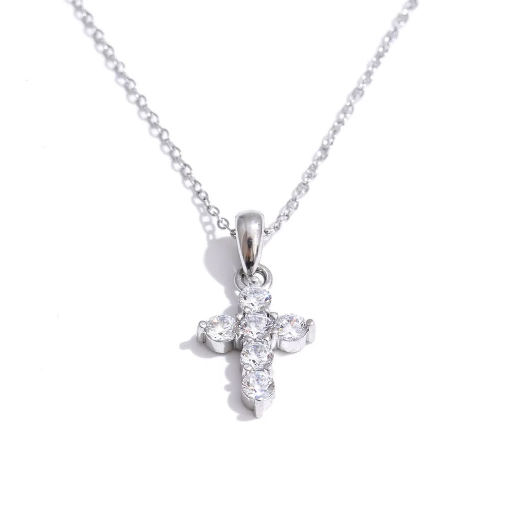 
                  
                    Silver petite cross original product photograph
                  
                