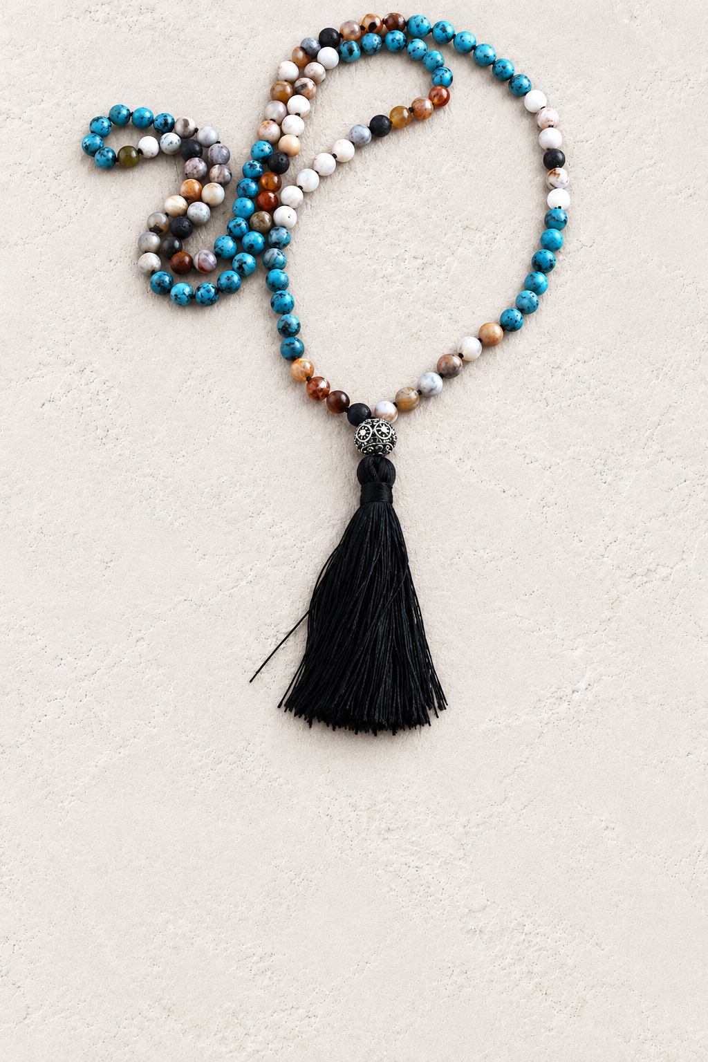 Prism Multicolour Mala Necklace on warm ivory plaster background
