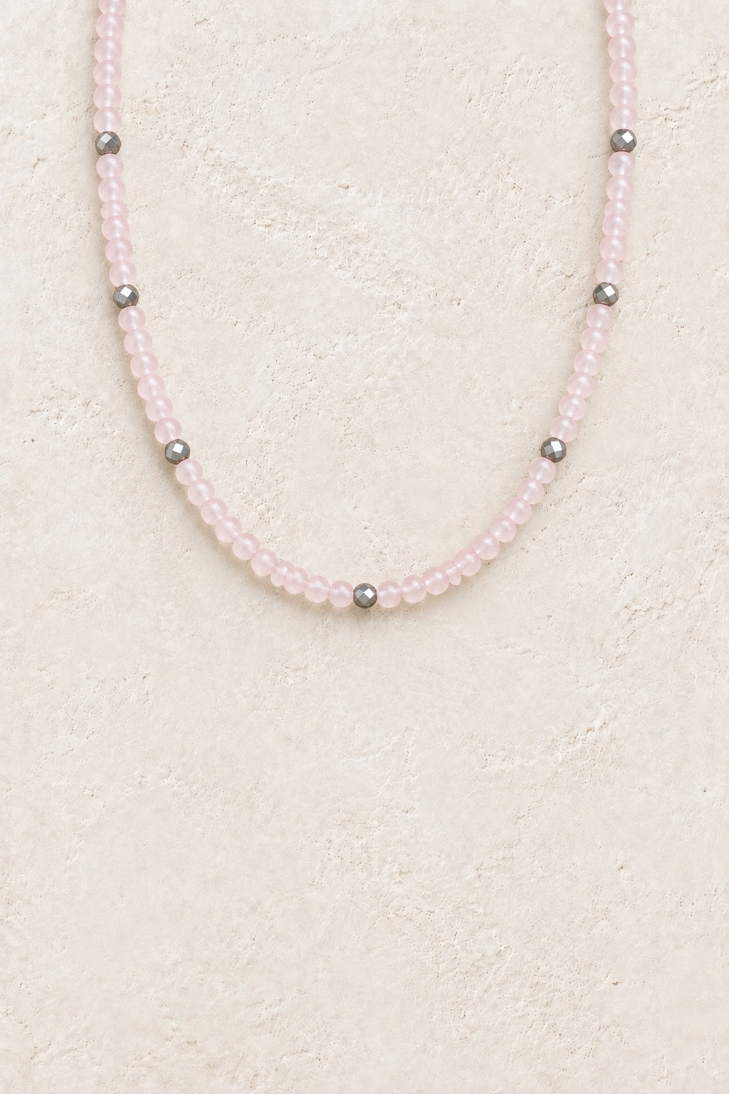 
                  
                    Rosalith Rose Quartz waterproof necklace with silver-tone faceted spacers on a neutral background
                  
                