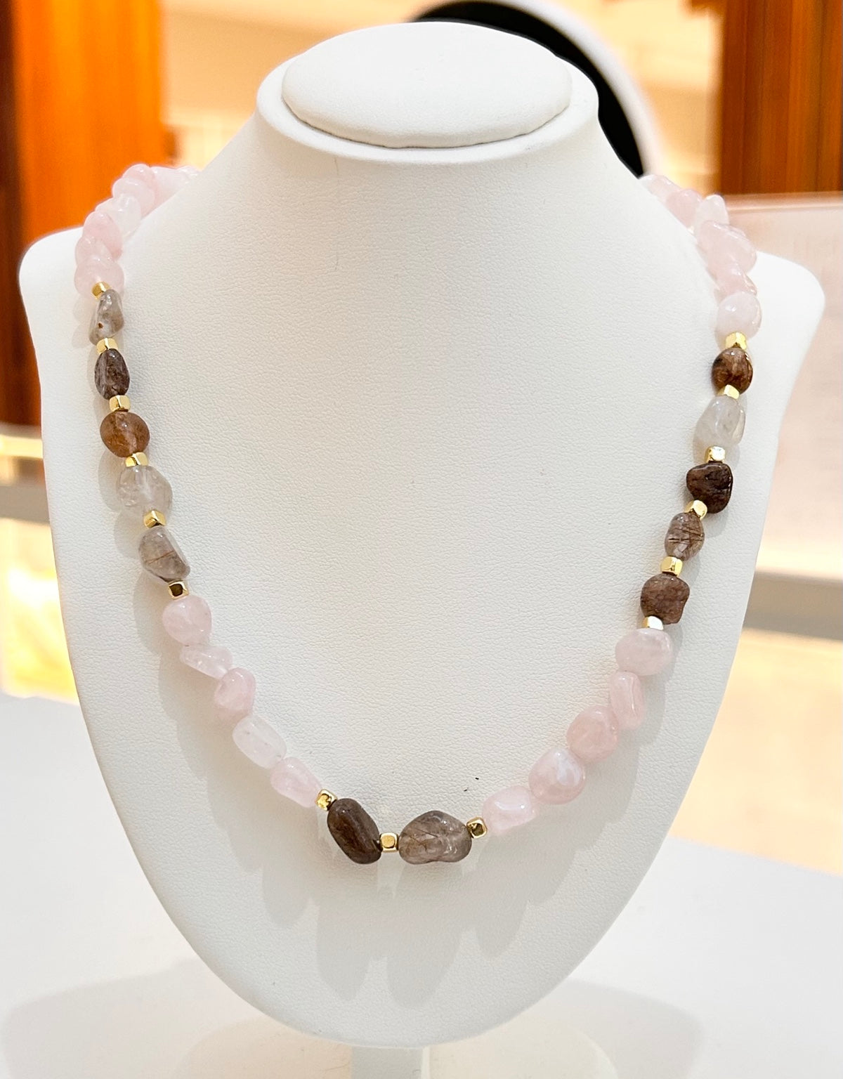
                  
                    Roselune Rose Quartz mixed stone necklace displayed on a white jewellery bust
                  
                