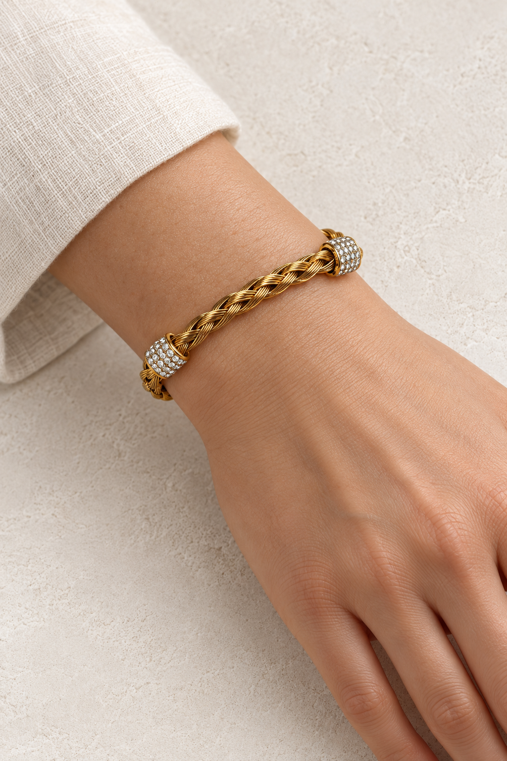 
                  
                    Model wearing Safira Gold Braided Crystal Cuff
                  
                