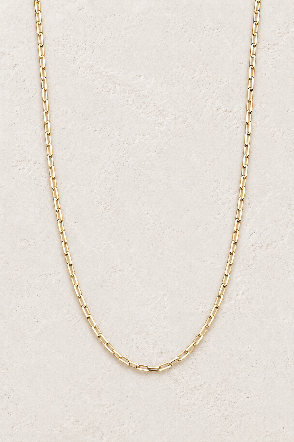 Seren Gold Link Necklace TF on the Boho & Mala cream stone hero background