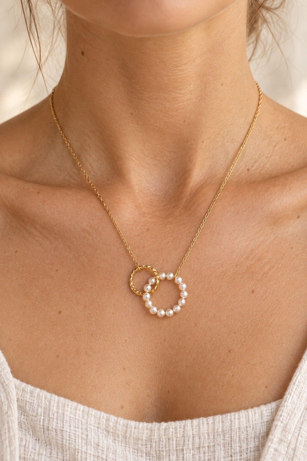 Model wearing the Serenelle pearl orbit waterproof necklace