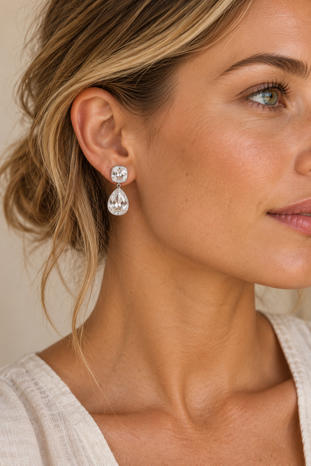 Silver 25mm cushion and pear crystal drop earrings worn on model