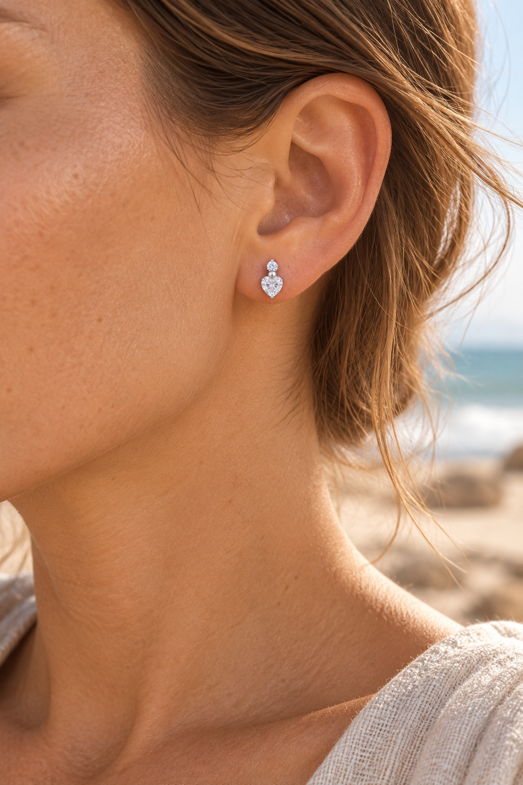 silver 10mm cubic zirconia heart studs worn on model