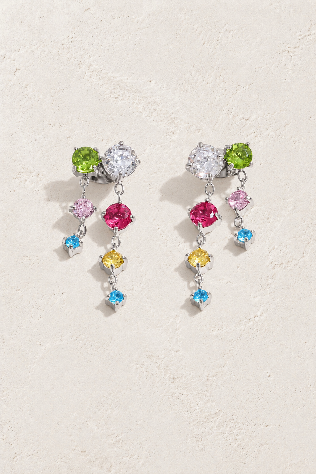 
                  
                    Silver Multicolour Crystal Twin Cascade Earrings — original cream plaster hero
                  
                