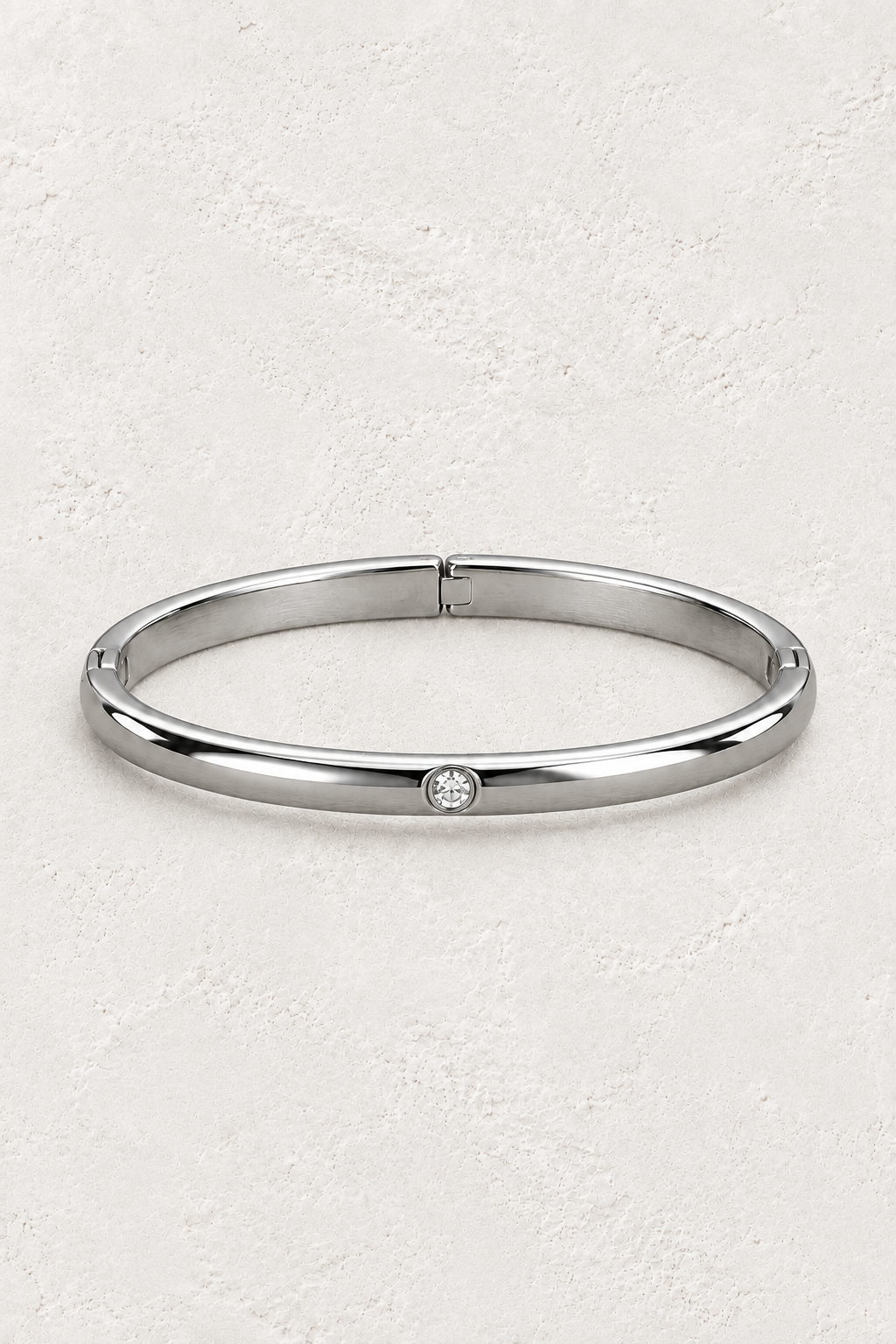 
                  
                    Sola Silver Solitaire Bangle — approved off-white background 2:3 cover
                  
                