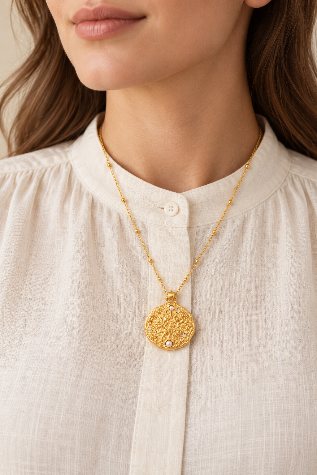 Soleil Pearl Sun Medallion Necklace worn on a model