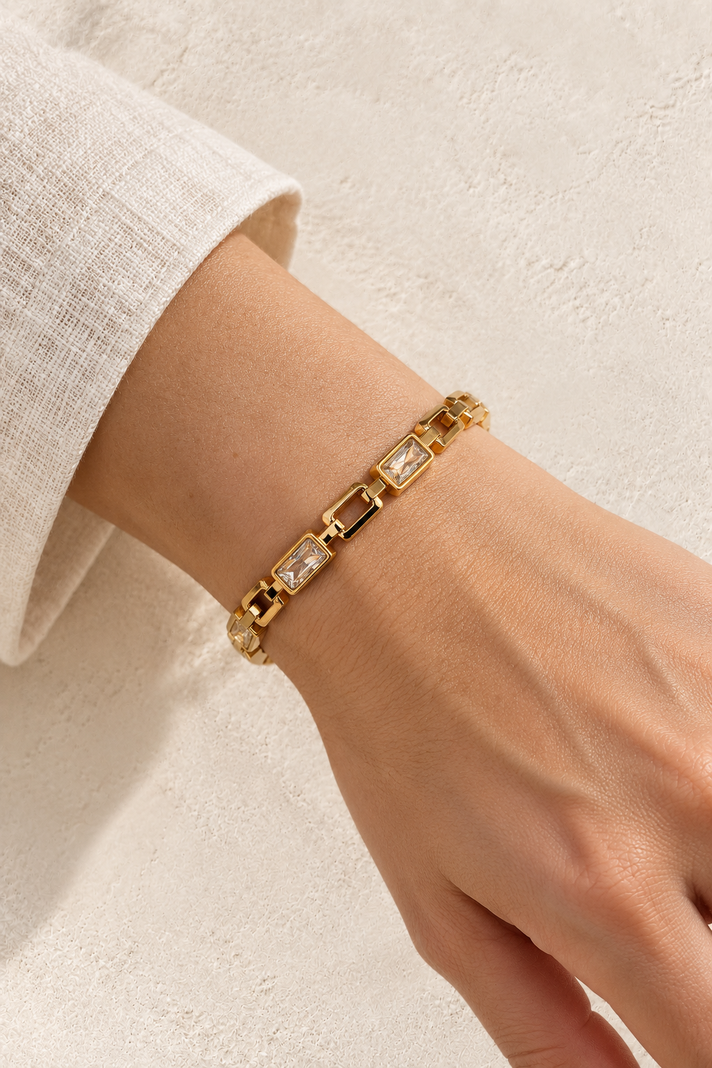 
                  
                    Model wearing Sorella Gold Rectangular Crystal Link Bangle
                  
                