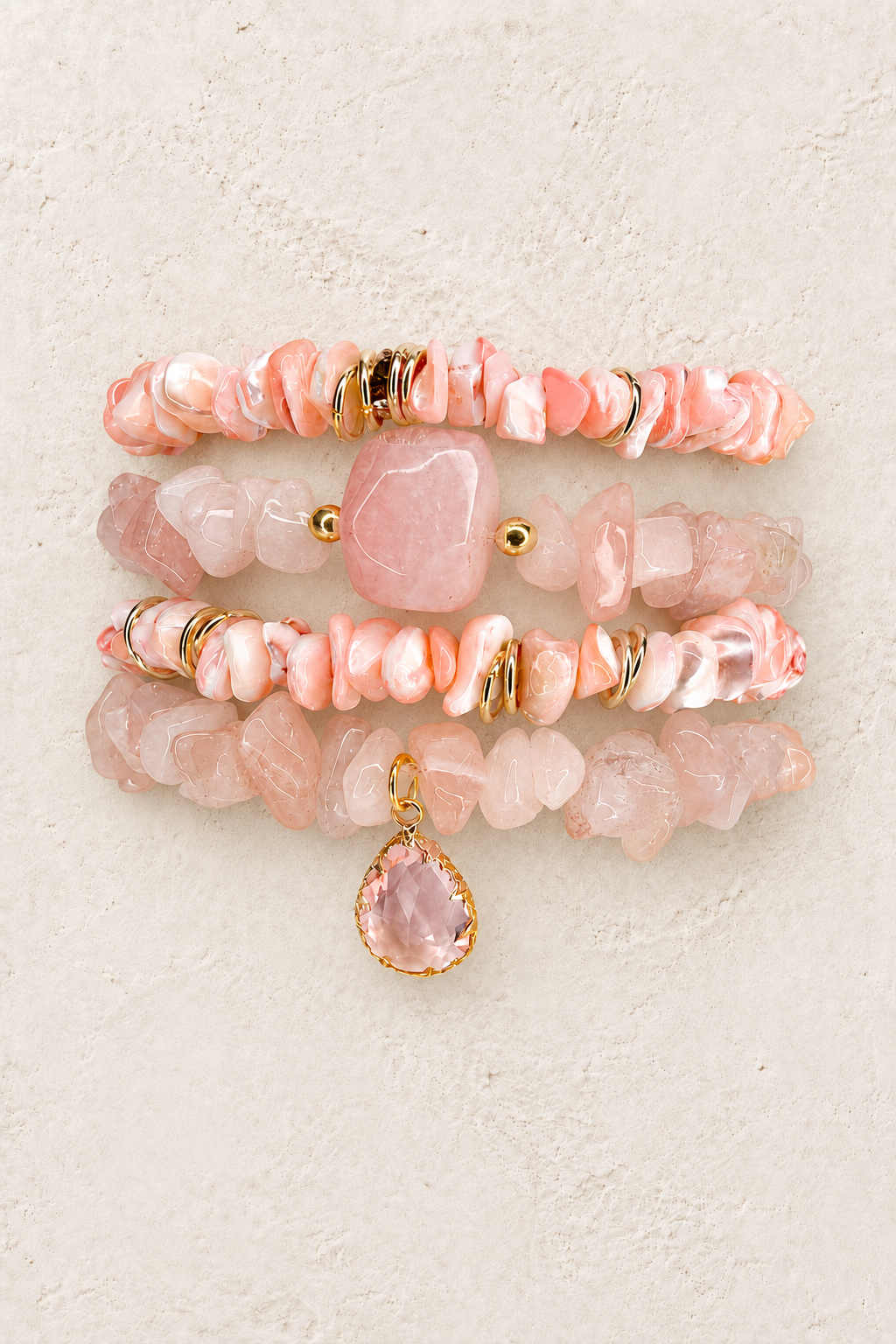 Sweet Serenity 4-piece elastic bracelet stack on warm textured background