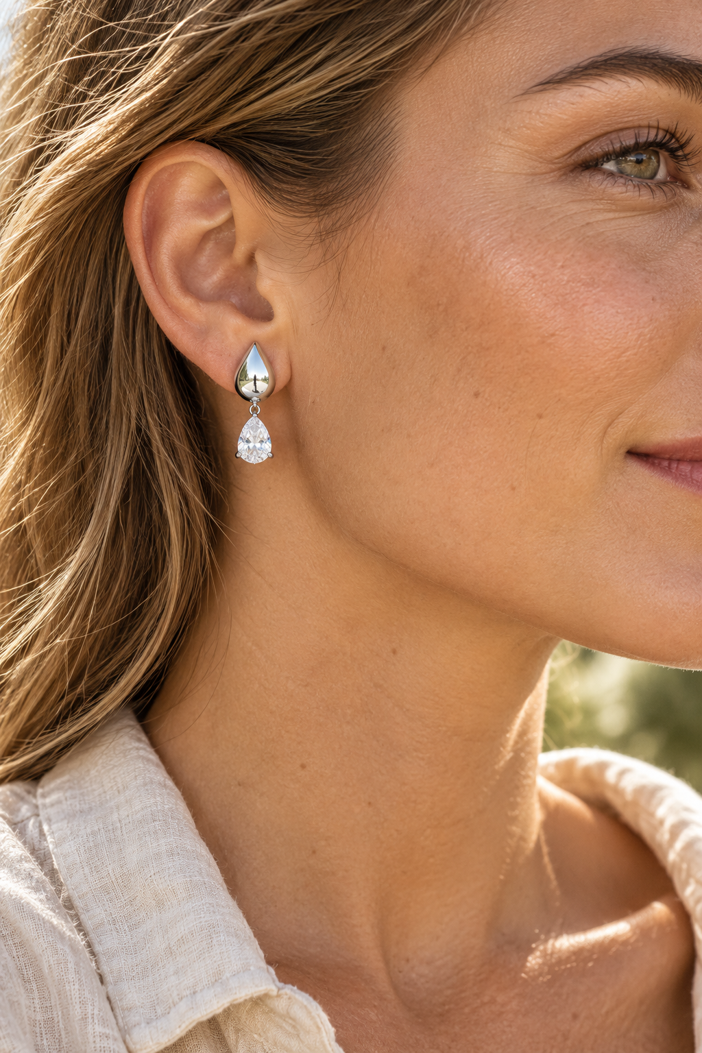 Silver Polished Teardrop Crystal Drop Earrings worn on a model