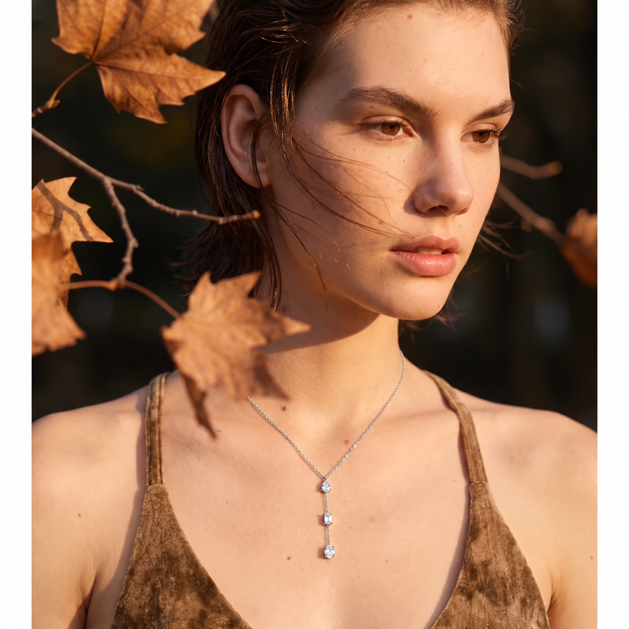 
                  
                    Silver three crystal lariat necklace worn on model
                  
                