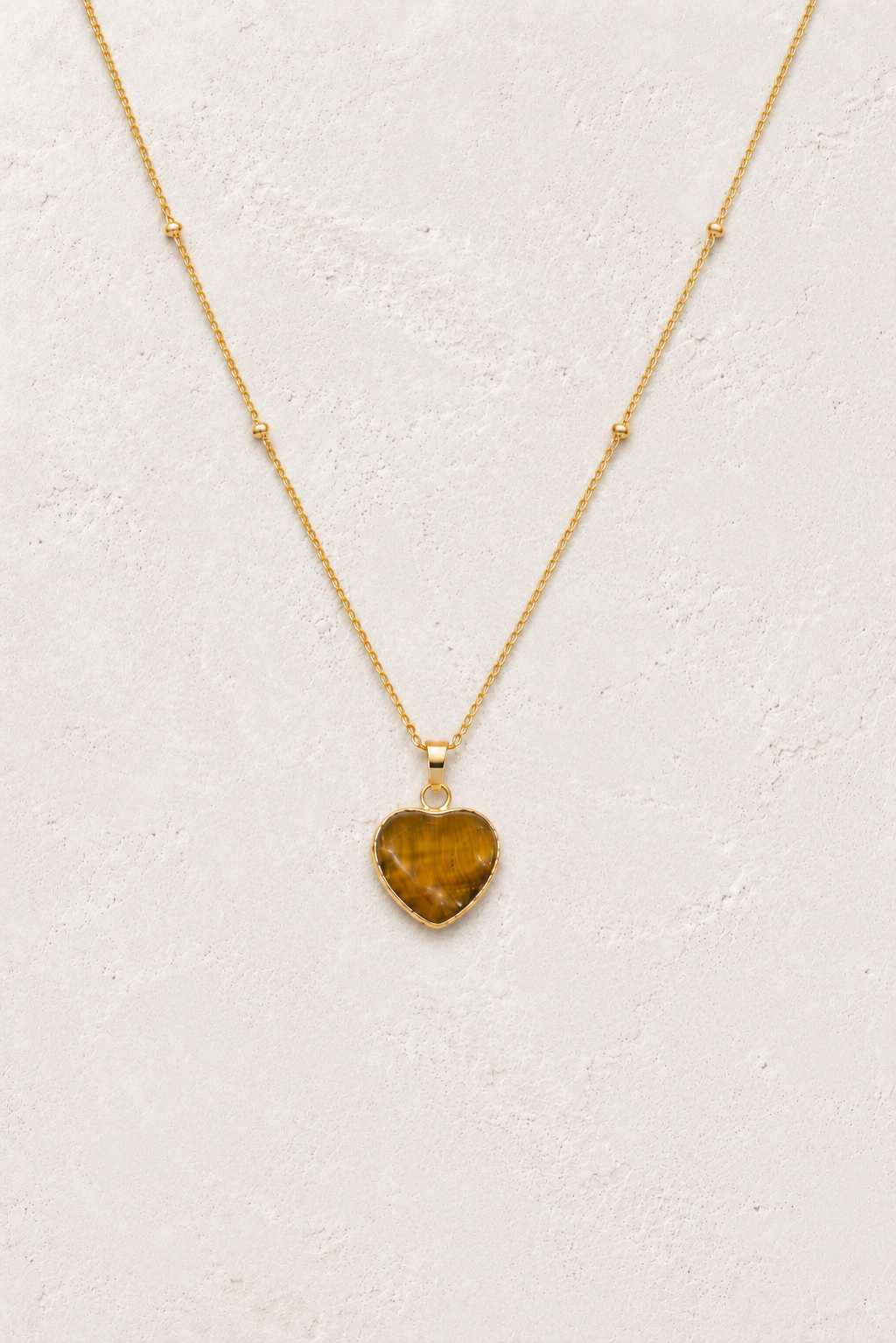 Tiger’s Eye Heart Necklace on the Boho & Mala cream stone hero background
