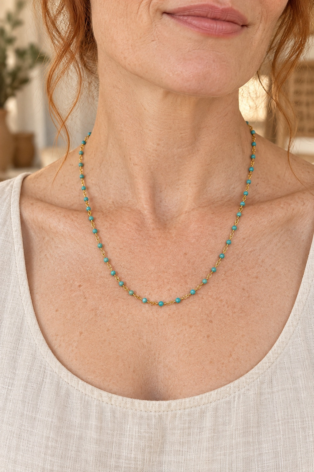 
                  
                    Boho model wearing the Tivara Turquoise gemstone beaded necklace
                  
                