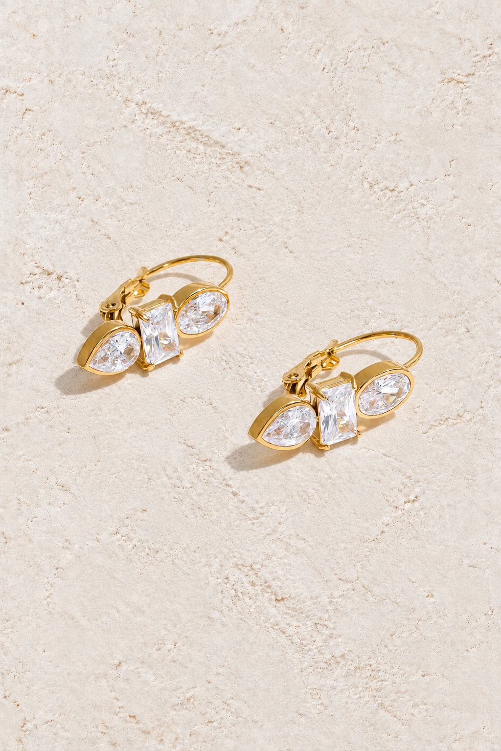Gold Mixed Crystal Trio Leverback Earrings on cream plaster