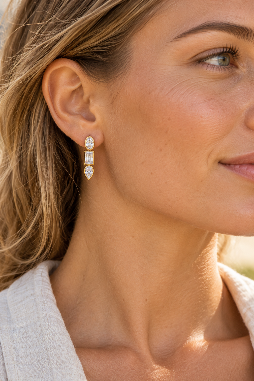 Gold Mixed Crystal Trio Leverback Earrings worn on a model