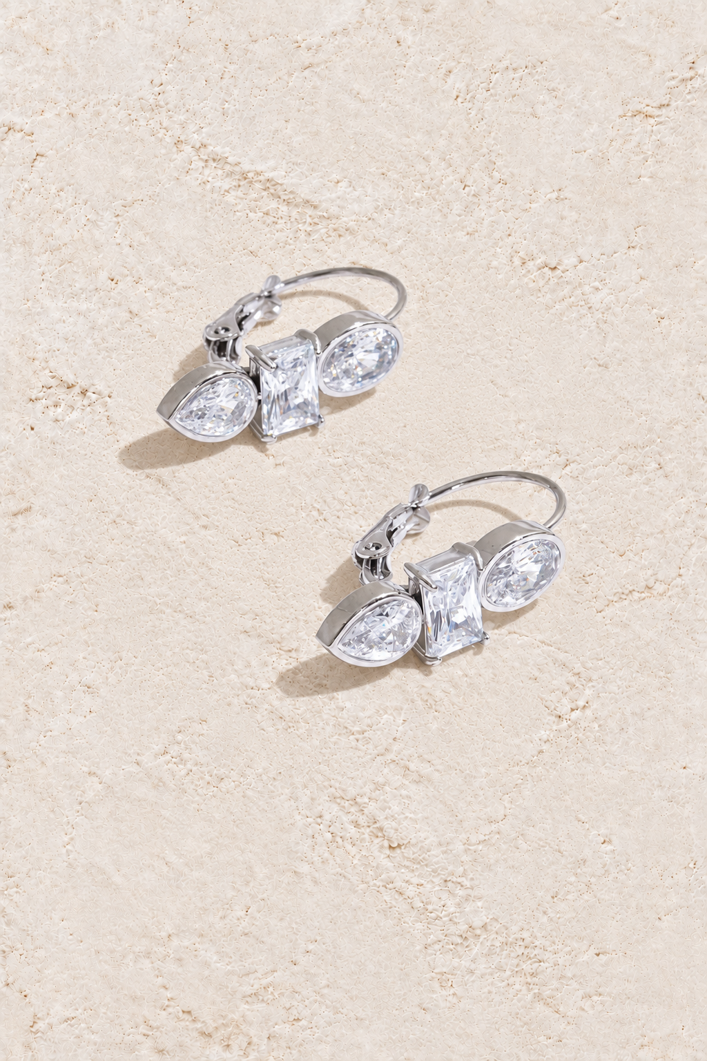 Silver Mixed Crystal Trio Leverback Earrings on cream plaster