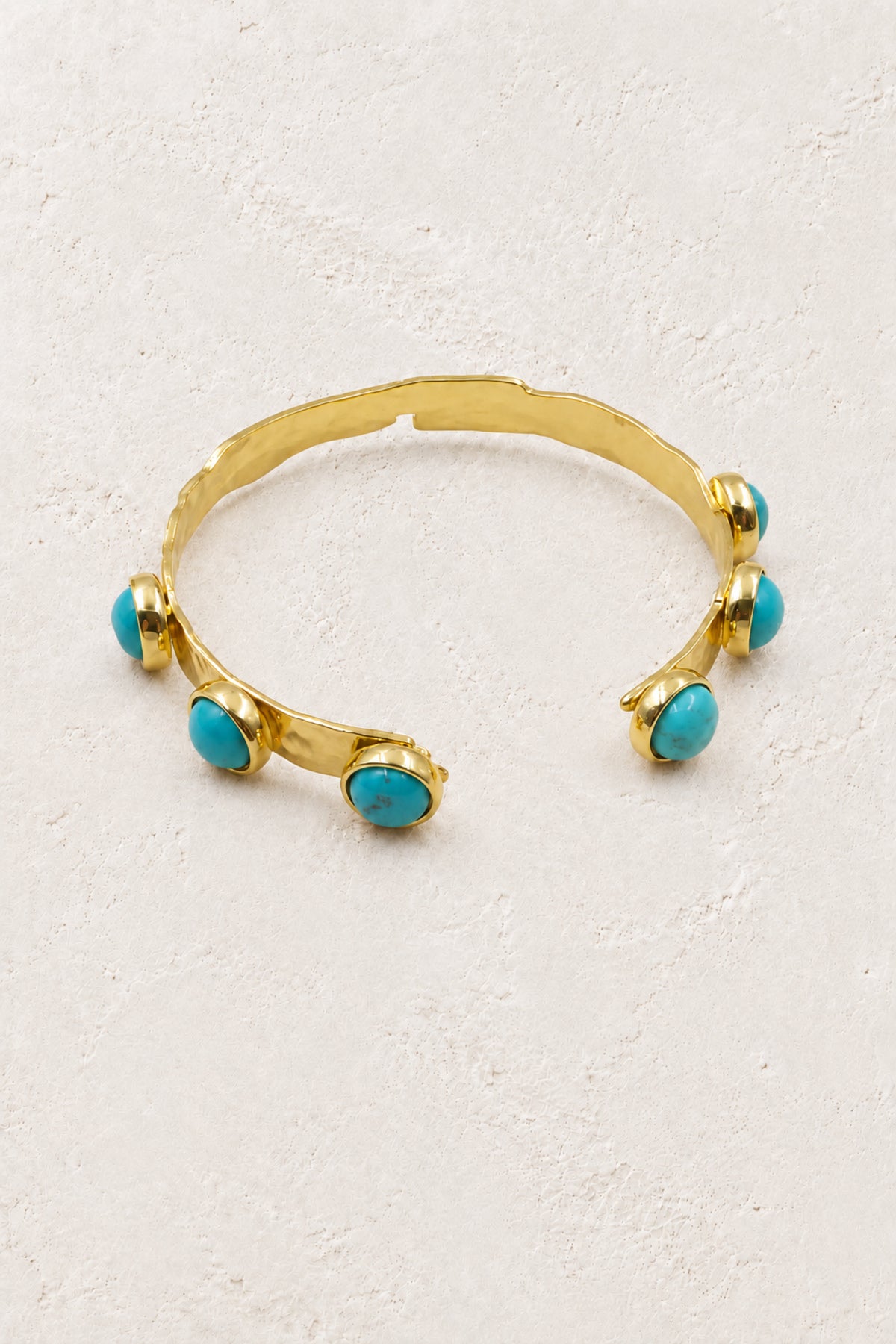 
                  
                    Boho & Mala Turquoise Gold Cuff Bracelet DCB1009 on the approved Boho & Mala ivory plaster background
                  
                