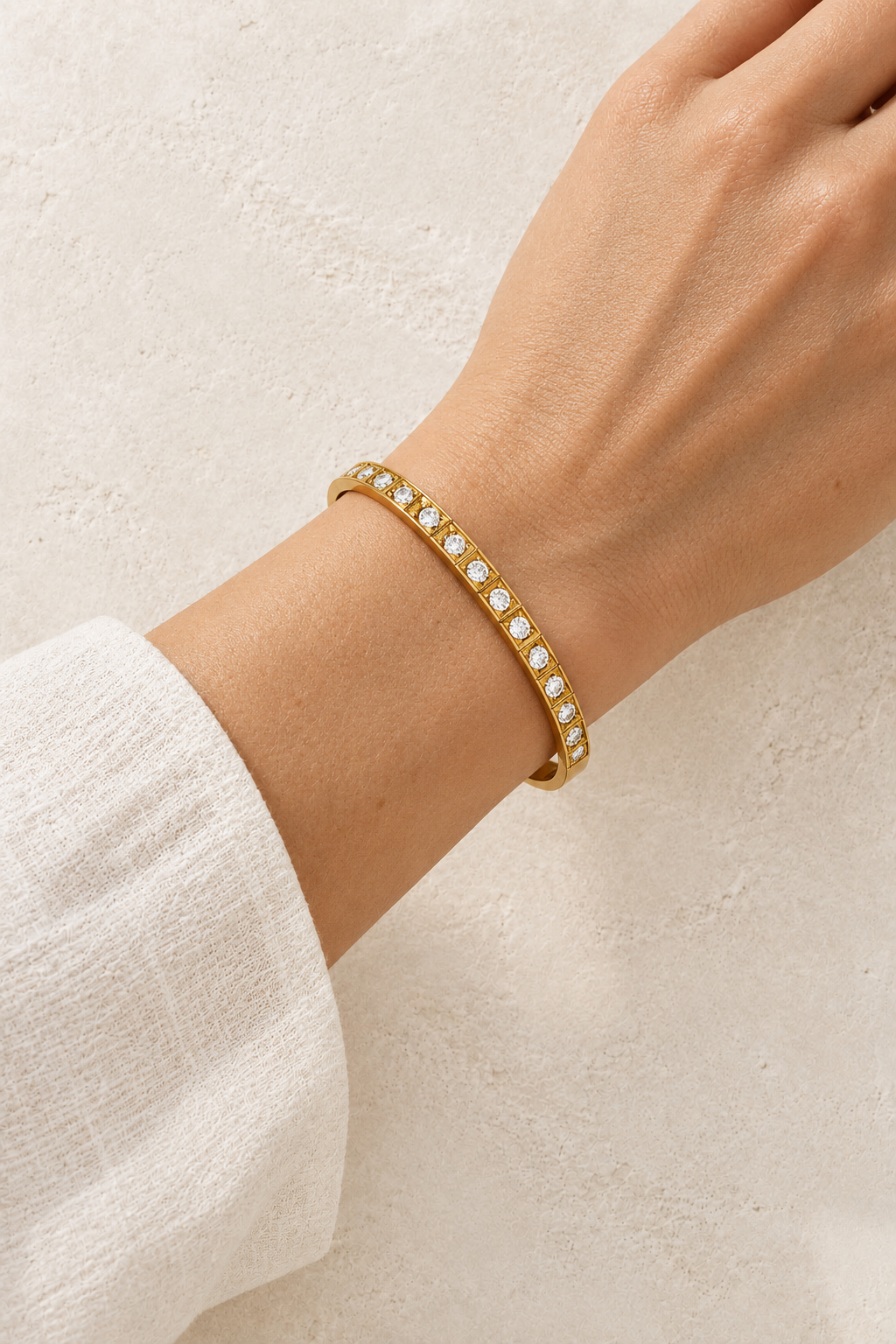 Model wearing Vela Gold Square Set Crystal Bangle