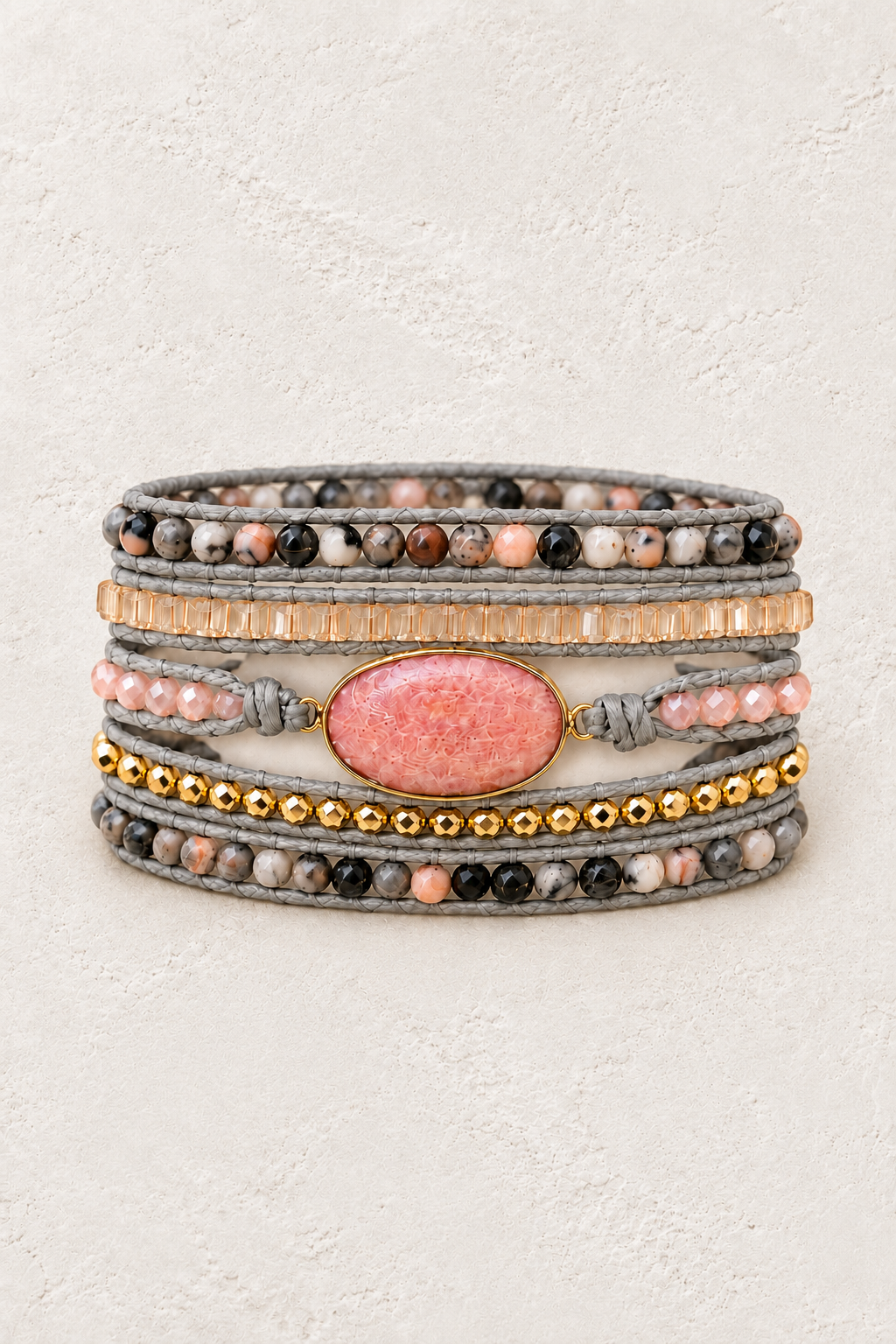 Handmade Pink Rhodonite Mixed Natural Stone Wrap Bracelet on the Boho & Mala warm-white textured background