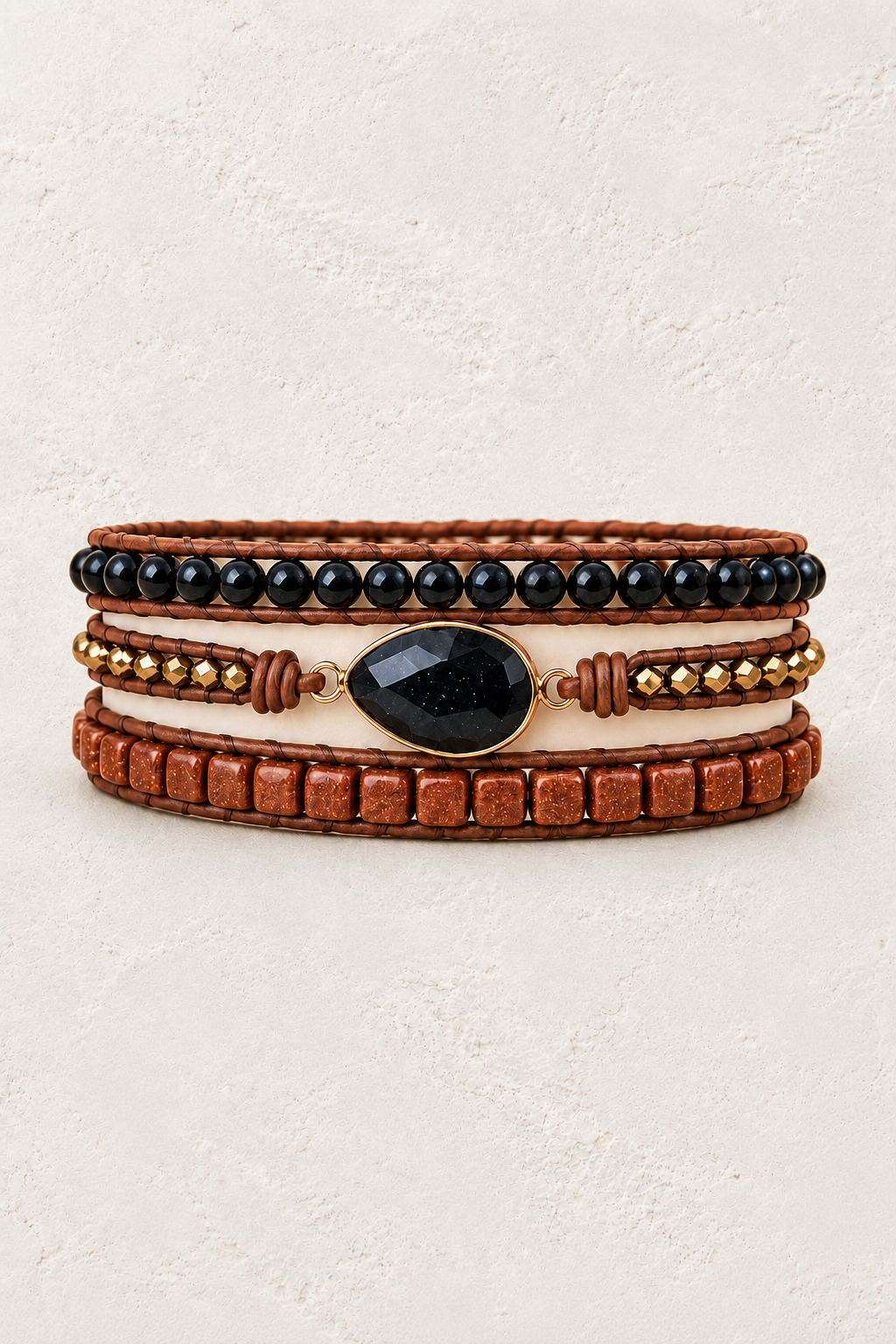 Handmade Black Onyx Mixed Natural Stone Wrap Bracelet on the Boho & Mala warm-white textured background