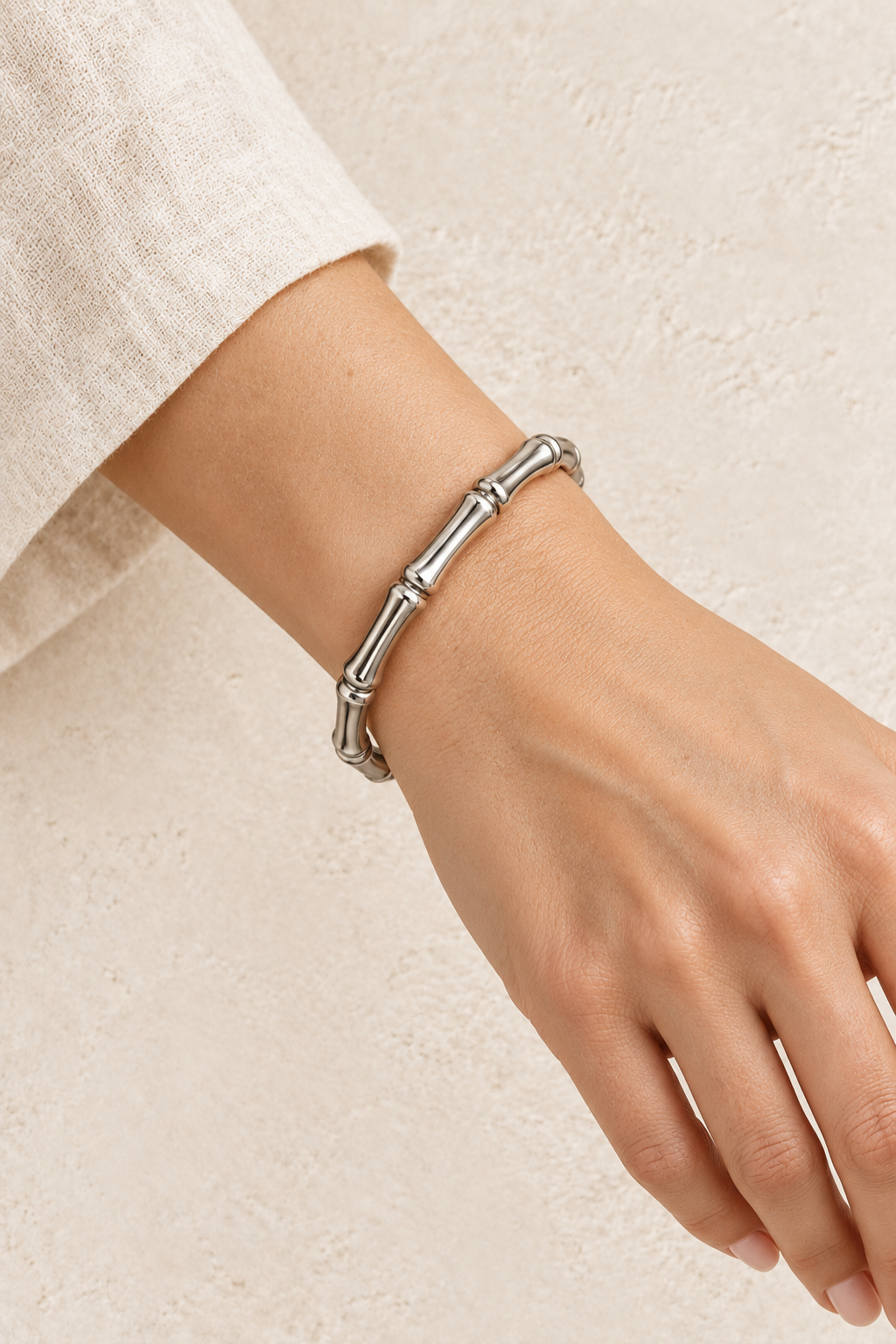 
                  
                    Model wearing Silver Bamboo Style Bangle | Waterproof
                  
                