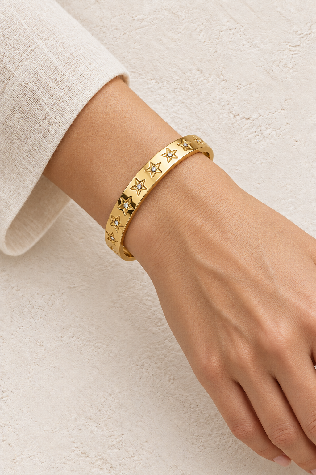 
                  
                    Model wearing Gold Star Crystal Bangle | Waterproof
                  
                